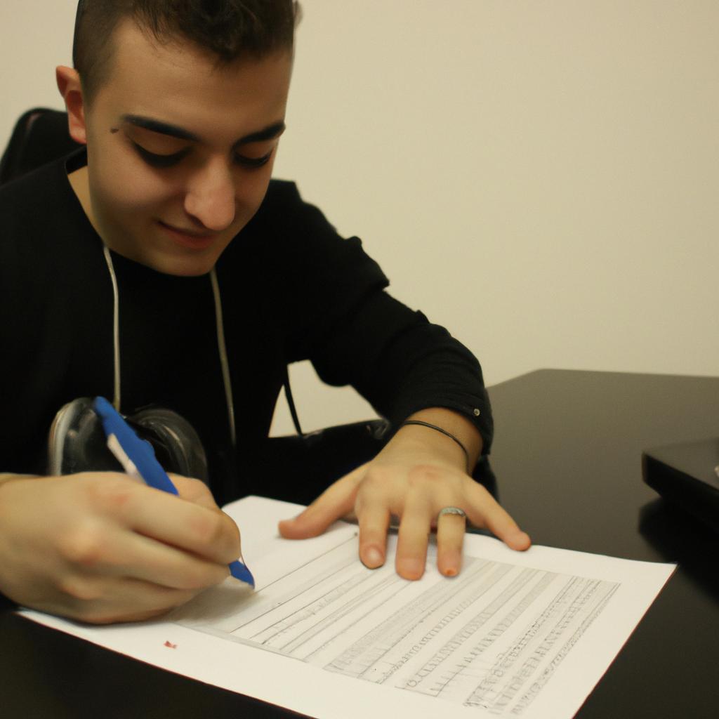 Person signing music contract, smiling